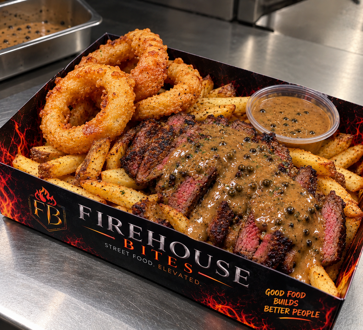 Fillet steak with skin-on fries, beer-battered onion rings and peppercorn sauce